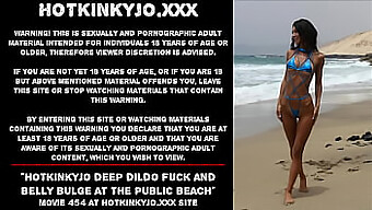 Deep Anal Play With A Dildo On A Public Beach, Featuring A Voluptuous Performer'S Bulging Belly